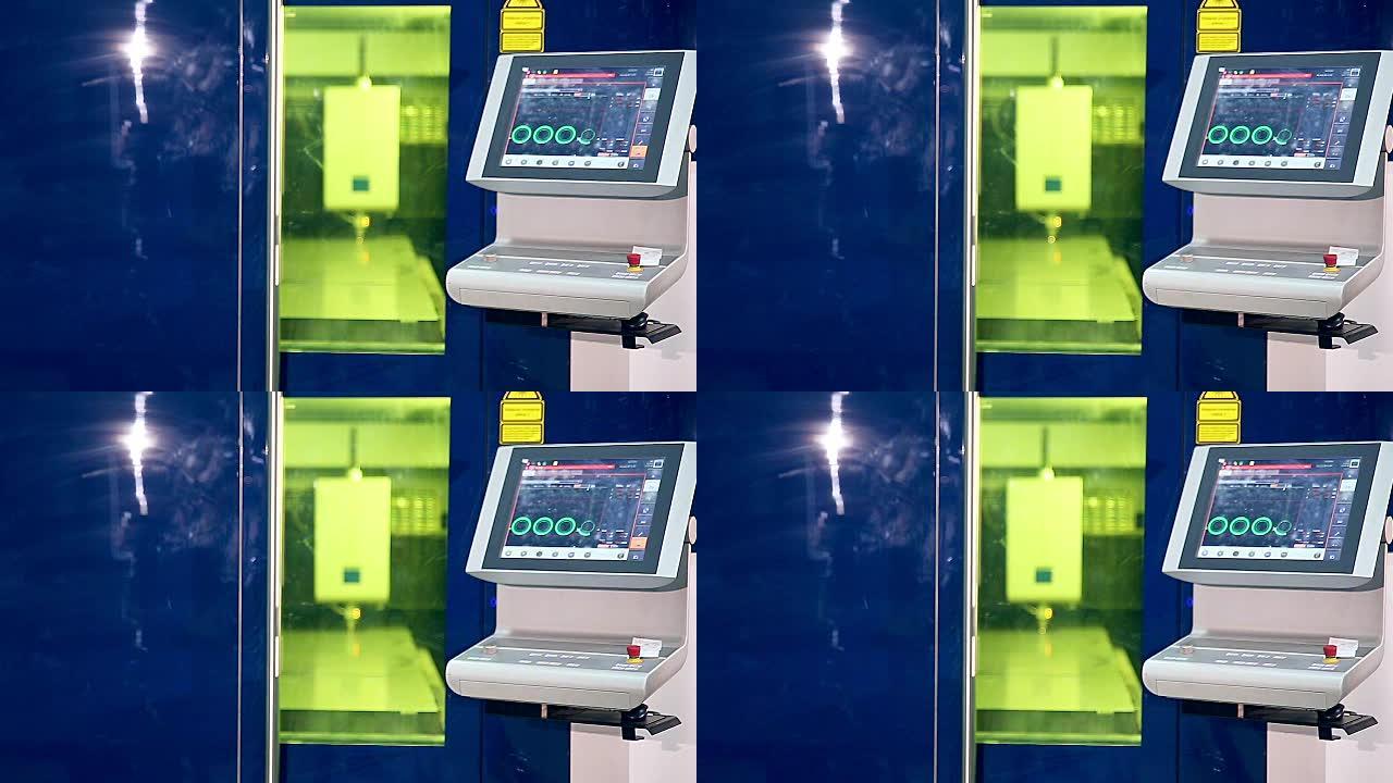 激光机器人金属切割机与metall一起操作。屏幕显示参数