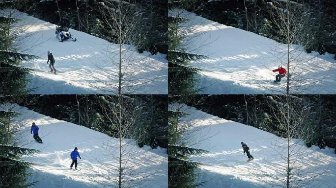 滑雪者，雪地摩托和单板滑雪者在斜坡上经过
