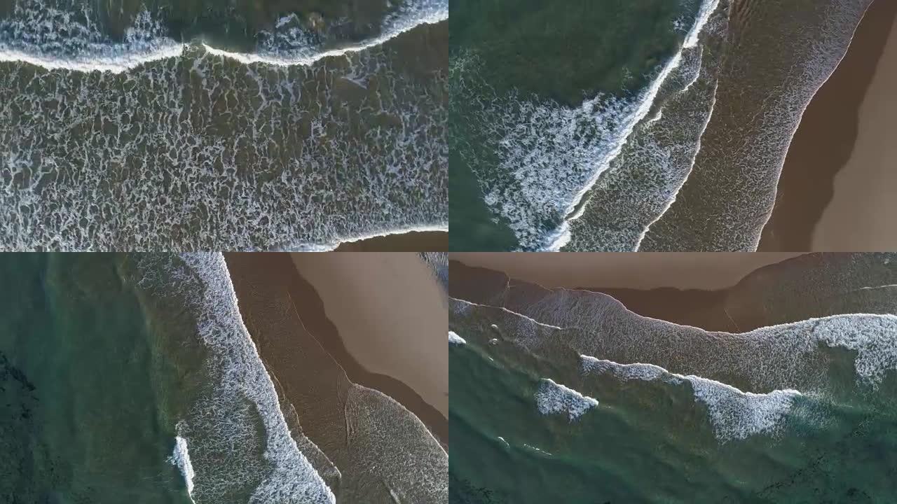 空中缩小海浪撞击海岸的圆形视图