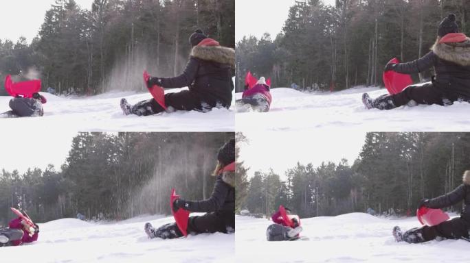 4k顽皮的女孩雪球在白雪皑皑的森林里打架，慢动作