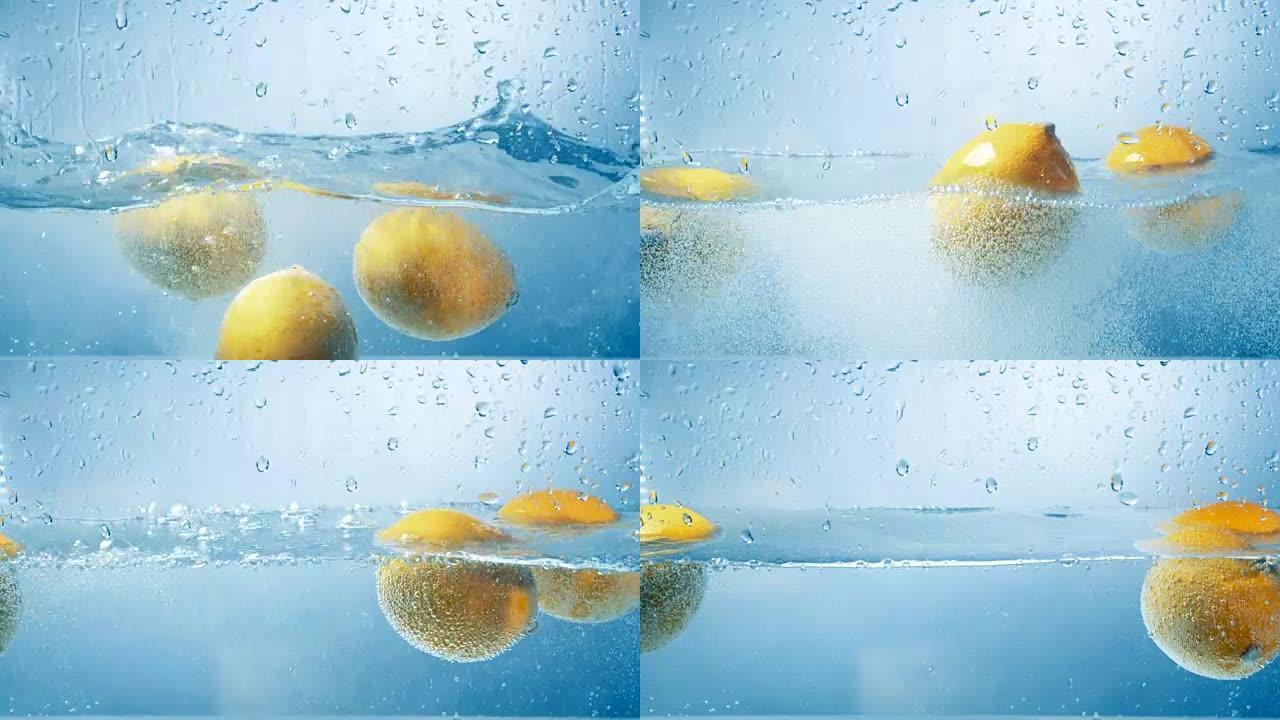 三个新鲜柠檬依次落入水中。