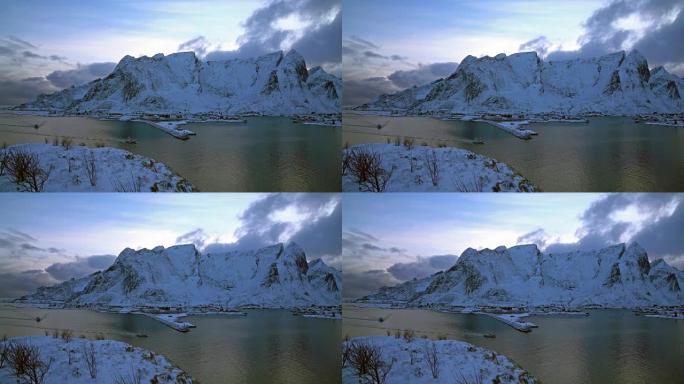 挪威罗弗滕群岛汉诺伊村多云湖的顶景雪山的4k剪辑