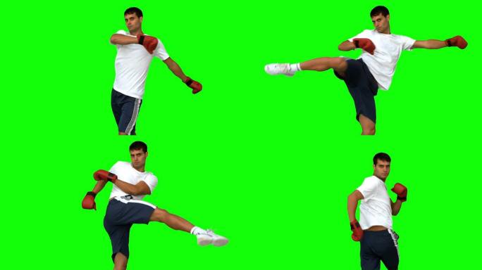 拳击手在绿色屏幕上进行空中踢