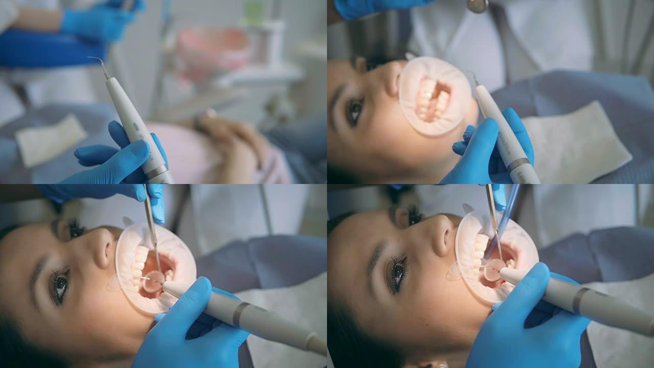 牙科器械的特写视图。去看诊所的女人，躺在牙科椅上。医生检查她的牙齿