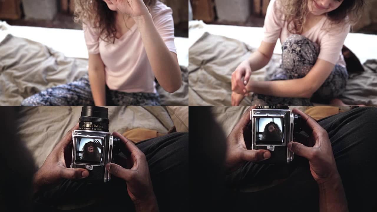 多民族夫妇有照片。旧移动胶片相机录像机中年轻女子的观点。男子拍照