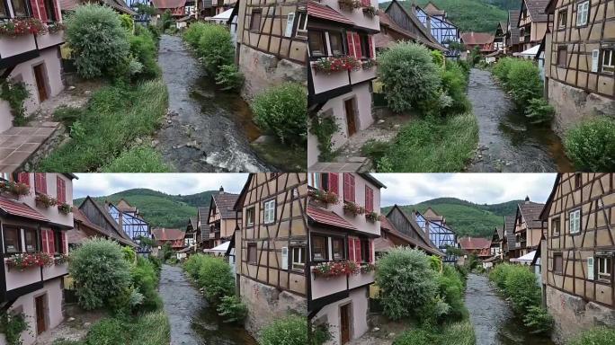 电影倾斜: 行人拥挤的Kaysersberg村庄城市景观阿尔萨斯法国