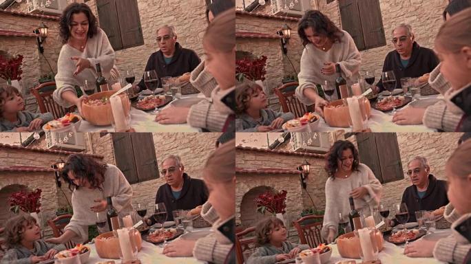 祖母在地中海村庄为家人提供自制午餐
