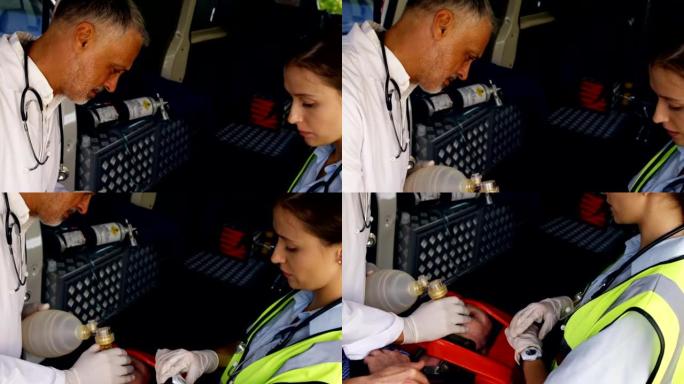 紧急医疗技术员放置氧气面罩