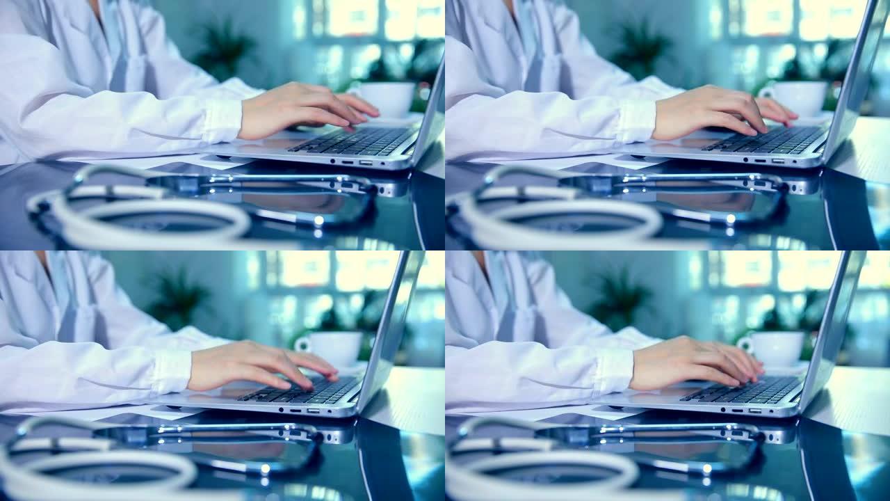 医生在医院办公室使用笔记本电脑