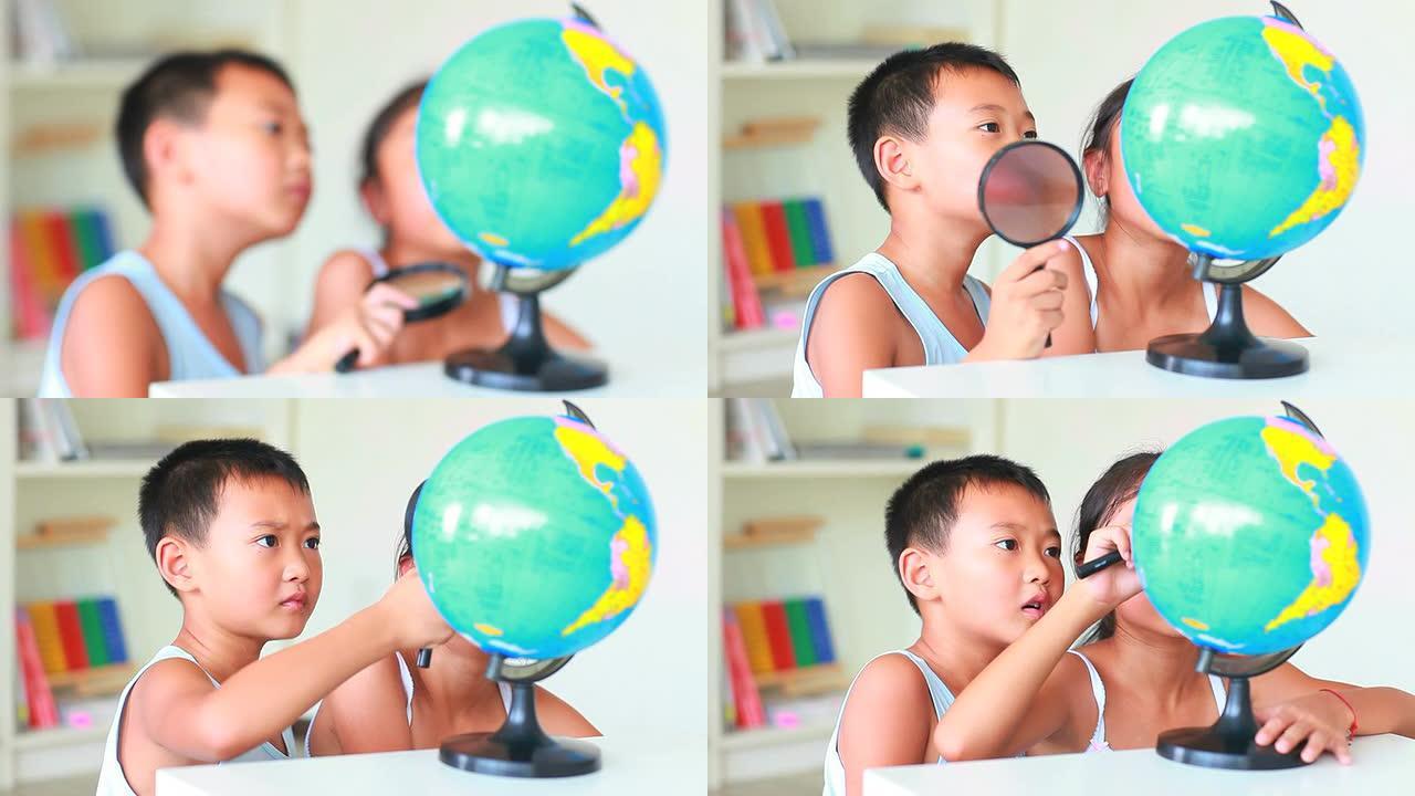 两个孩子一起学习地球仪