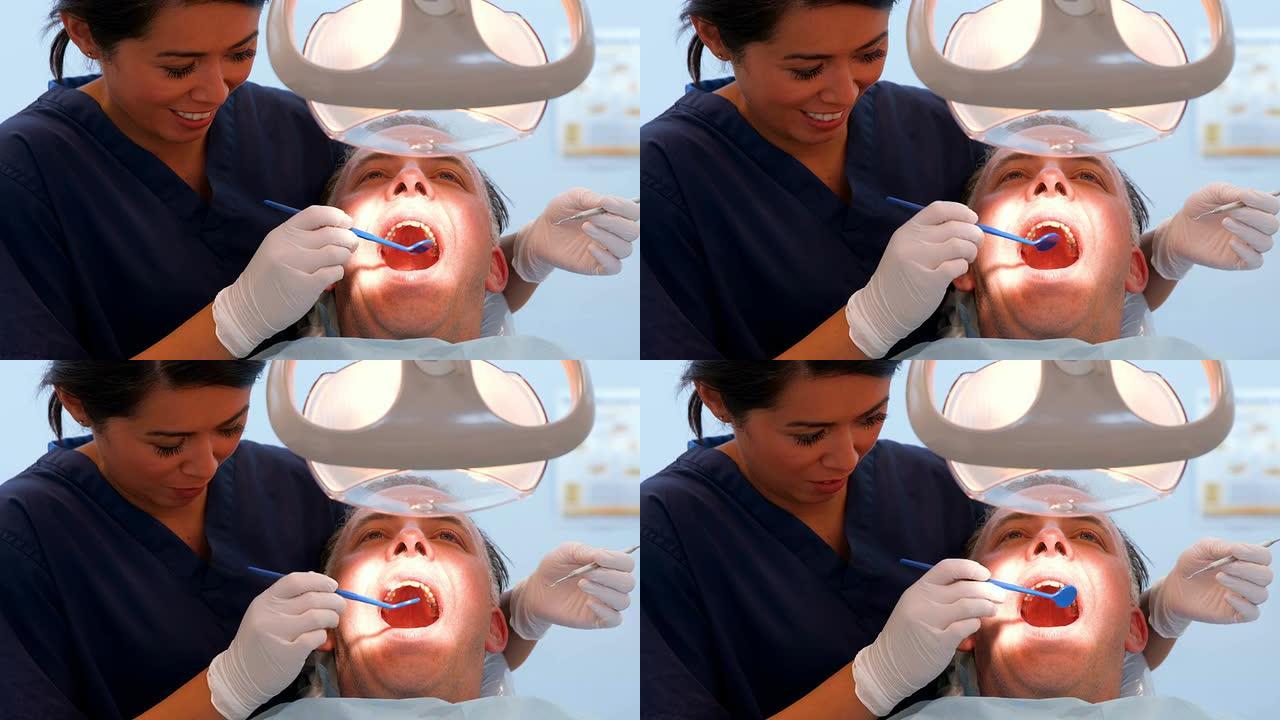 牙医检查患者的牙齿