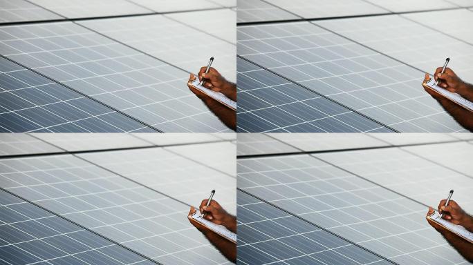 手工记录光伏电池板太阳能场的数据。