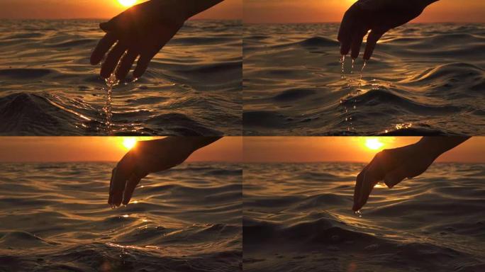 慢动作: 手玩海水，水滴从指尖掉落