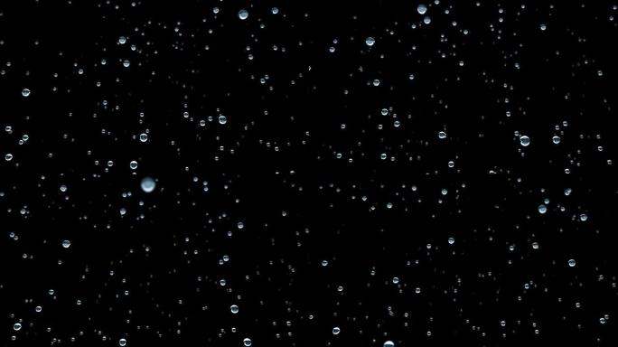 在黑色背景上的太空中冻结水滴，相机飞行的无缝动画