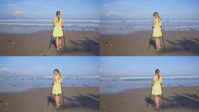 近距离观察坚强的女人与拐杖微笑在夏季的热带海滩
