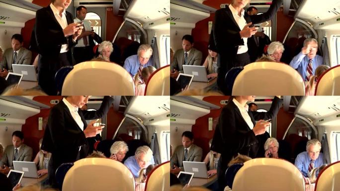 在繁忙的通勤火车上使用手机的女商人