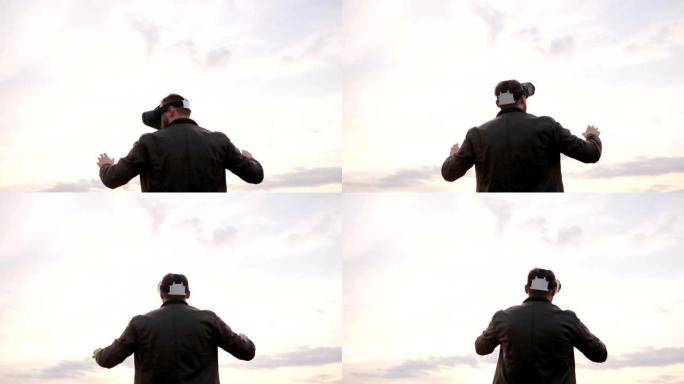 男人用虚拟现实眼镜对着天空