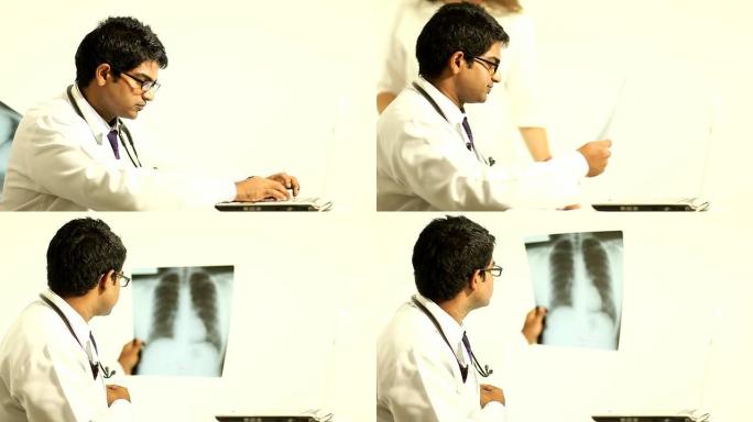 医生在笔记本电脑上打字，然后检查X光肺