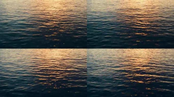日落时海水上方低空飞行