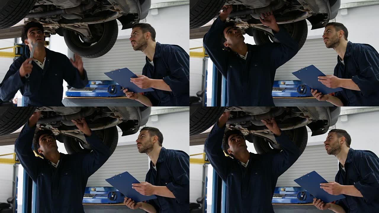 英俊的机械师检修汽车
