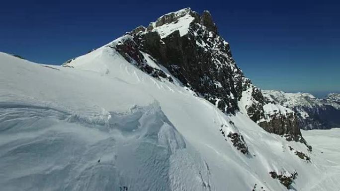 Establishing shot of snowy mountain top landscape 