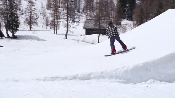 高清：滑雪板运动员抓地动作的超级慢镜头