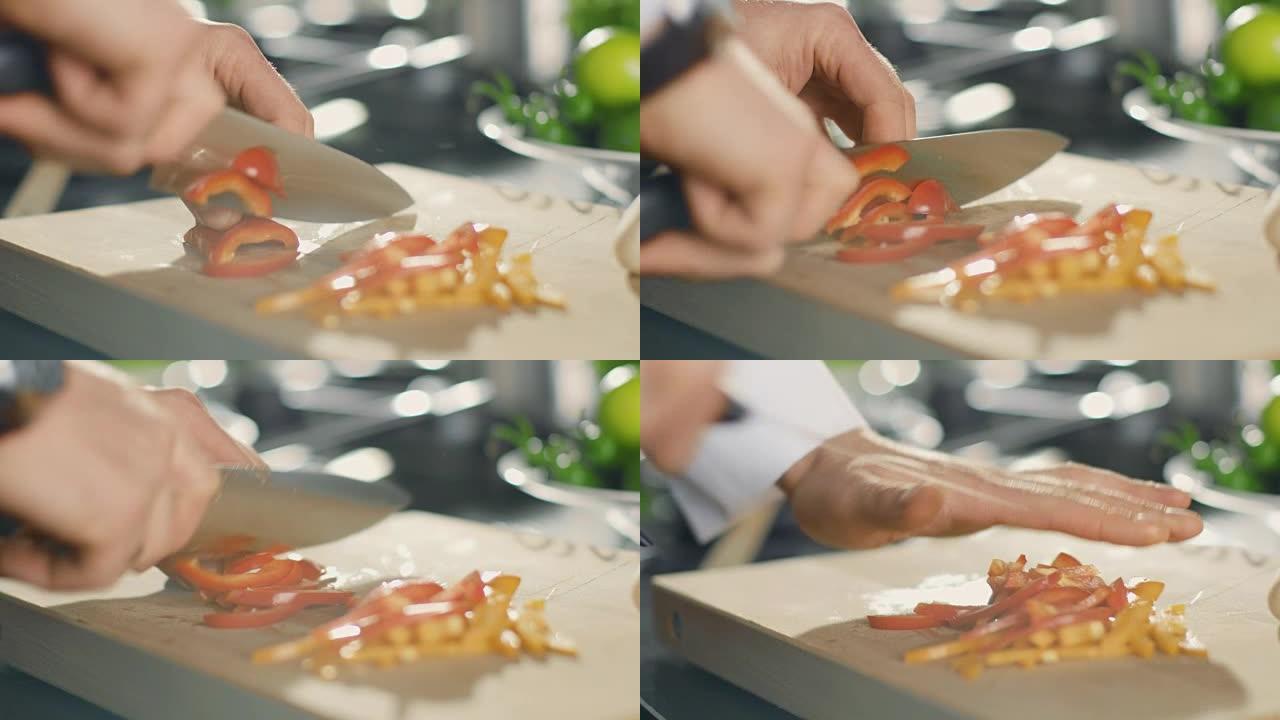 厨师在切菜板上巧妙地切五颜六色的蔬菜的特写镜头。西红柿和蘑菇。