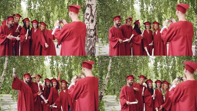 即将毕业的学生正在录制他的朋友们穿着礼服的视频，他们拿着文凭，挥舞着双手，摆姿势看着智能手机摄像头。