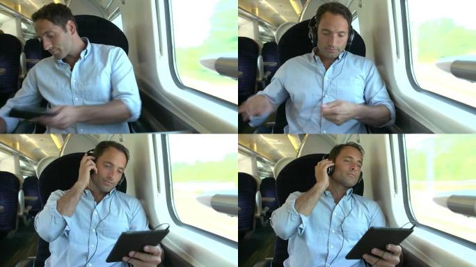 男子在火车旅行中听音乐