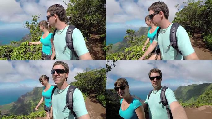 自拍照: 微笑的年轻夫妇在夏威夷丛林山区度假远足