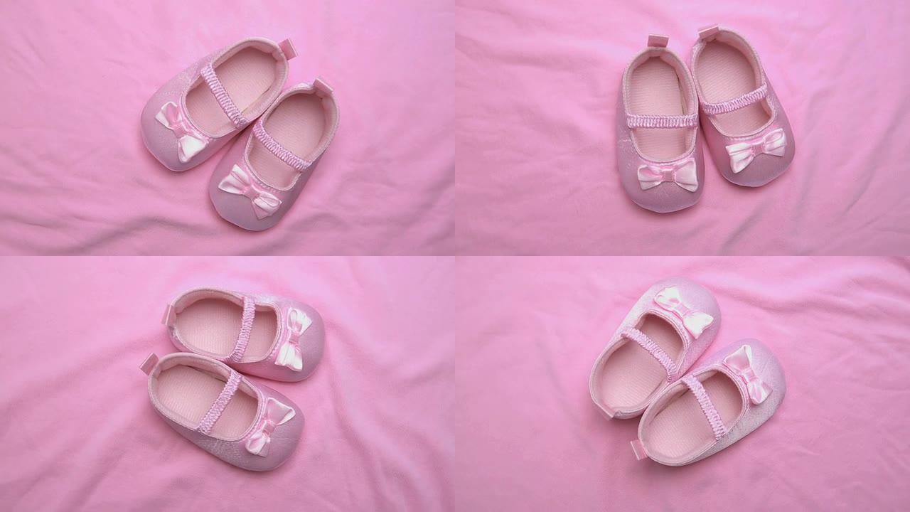 粉色毛毯上的粉色婴儿短靴