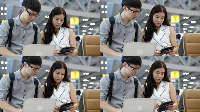 两名亚洲人在机场办理登机手续时发现航班信息
