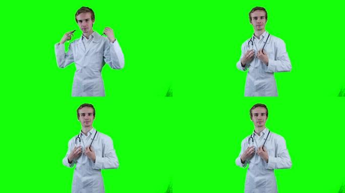 一名穿着白大褂和听诊器的白人初级医院医生的肖像。背景绿屏，chromakey