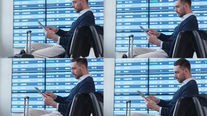 男子在机场候机室等候登机时使用平板电脑。