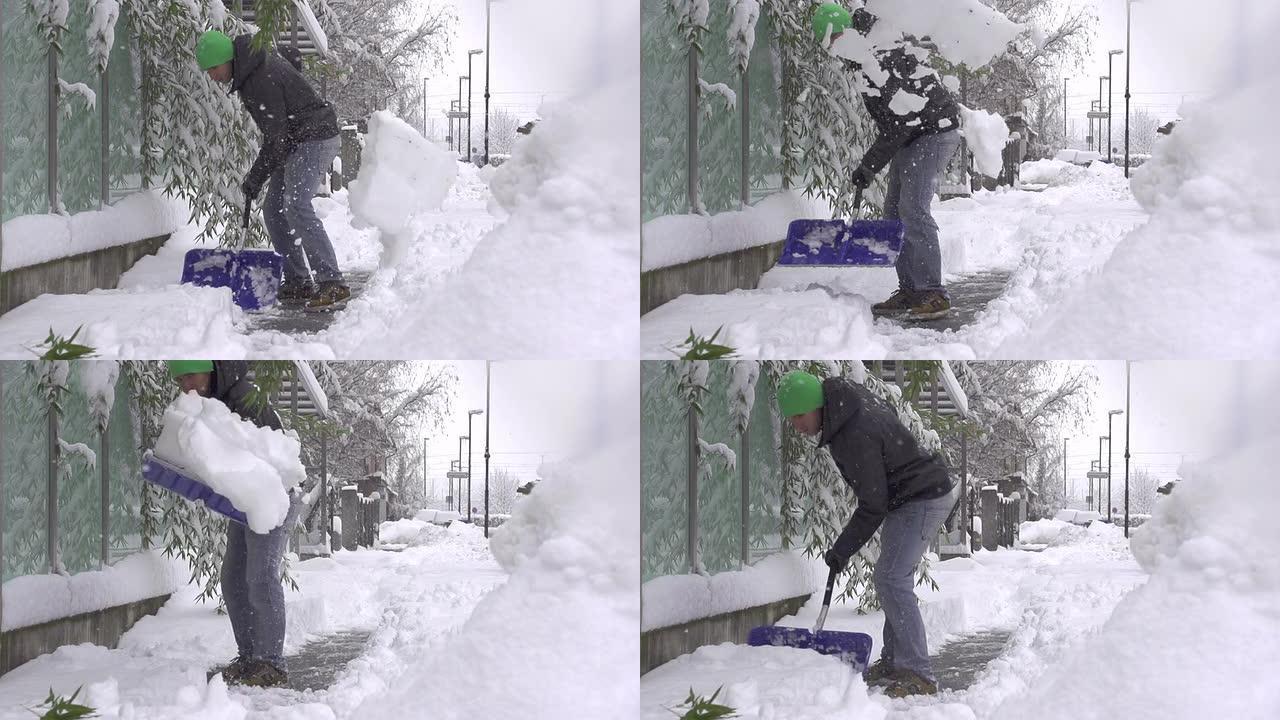 慢动作: 男子从人行道上除雪