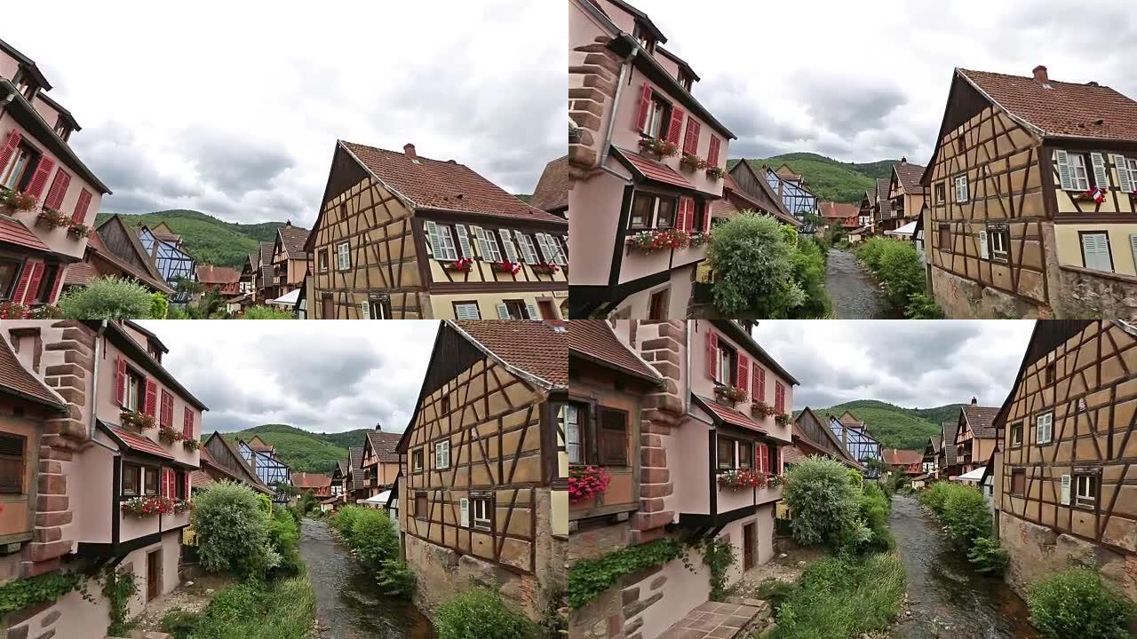 电影倾斜: 行人拥挤的Kaysersberg村庄城市景观阿尔萨斯法国