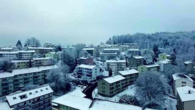 Arial shot of snow covered village in wintertime