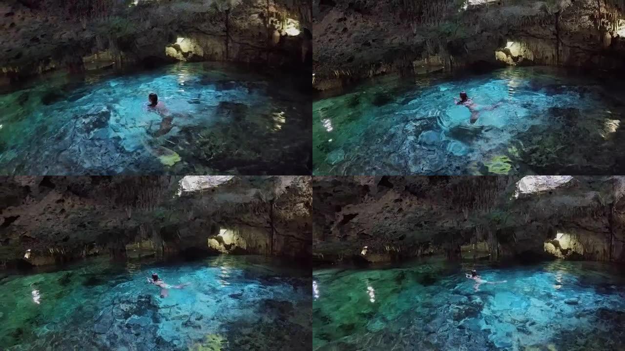 关闭游客在阿克顿陈污水坑的绿松石地下水池中游泳