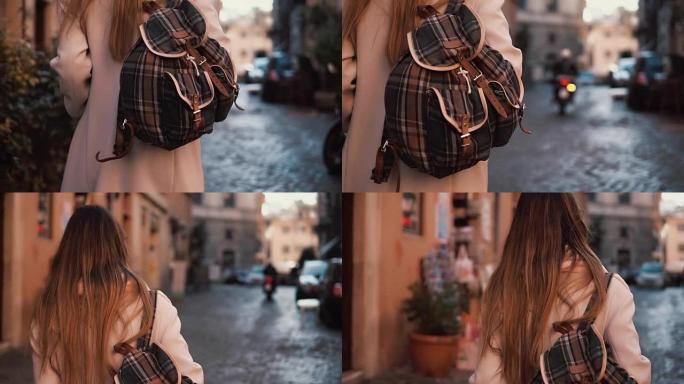 背着背包走在街上的年轻旅游女子的后景。漂亮女孩在欧洲度假