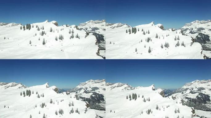 Aerial view of snow covered mountain range with be