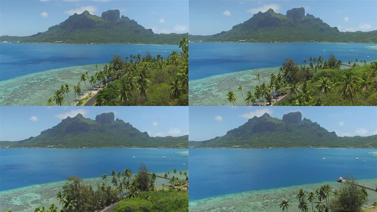 4k天线: 在美丽的波拉波拉岛度假胜地上空飞行，主岛上有著名的山峰，阳光明媚的夏天有梦幻的蓝色泻湖