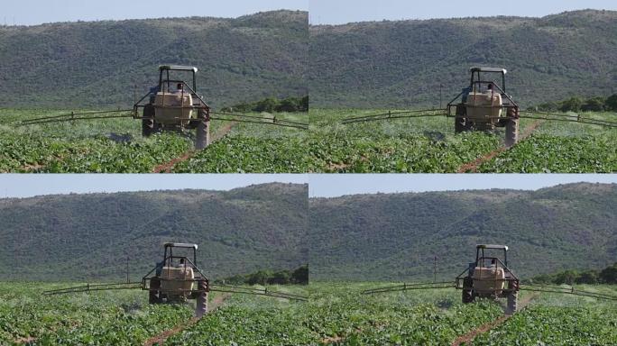 拖拉机用杀虫剂喷洒蔬菜