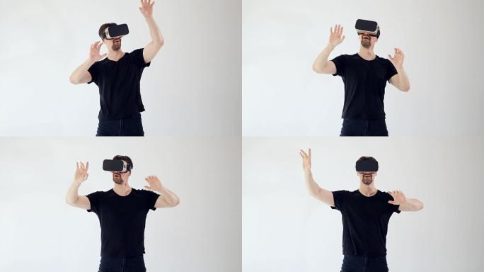 一个戴着VR耳机的年轻人伸出双手。
