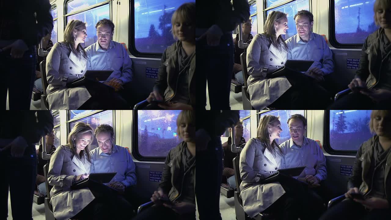 公交车上的通勤者玩数字平板电脑
