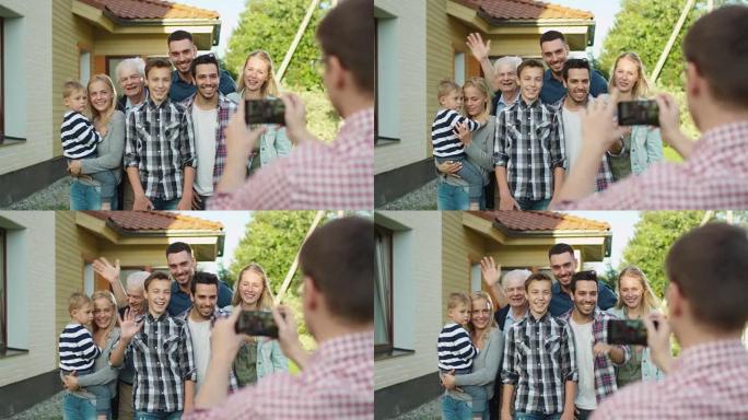 男人在给他的大家庭拍户外照片。