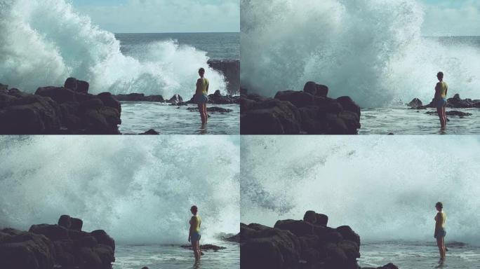 慢动作: 无法辨认的女人看着猛烈的海浪飞溅