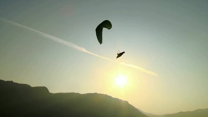 高清: 日出时滑翔伞的轮廓