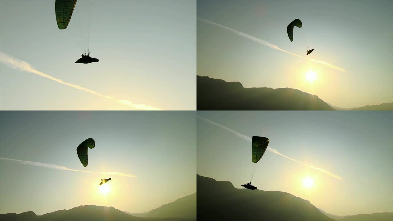 高清: 日出时滑翔伞的轮廓