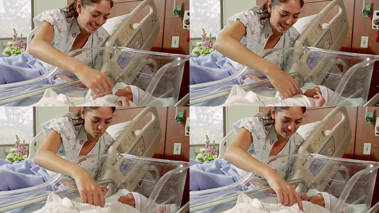 在R3D上拍摄的婴儿在医院病床上的母亲