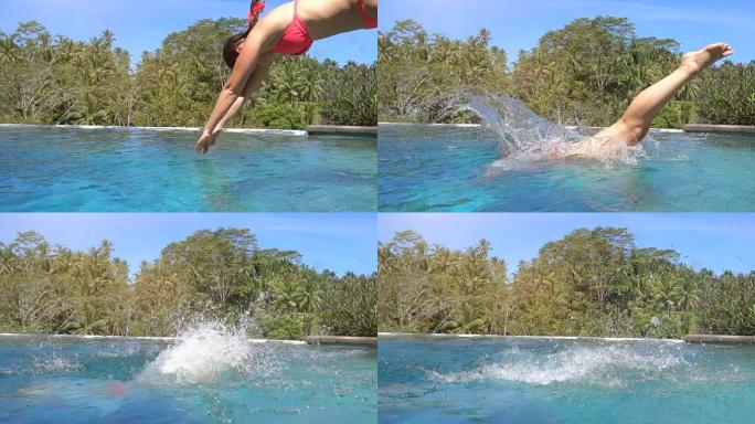 慢动作: 女性在阳光明媚的巴厘岛丛林度假胜地的无边泳池中潜水